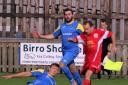 Barnoldswick's Shaun Airey puts a tackle in on Liverpool's Michael Williams  Pictures: Pete Naylor