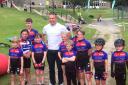 Bronte Tykes members proudly show off their new kit while meeting Olympic legend Sir Chris Hoy in Skipton recently