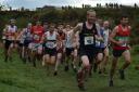Tom Adams, right, is at the front of the pack on his way to victory in the Withins Skyline fell race. Picture: Dave Woodhead
