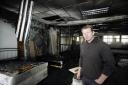 Andrew Foster in the fire damaged furniture business he was about to open