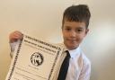 Luke Greenwood with his 1st dan karate certificate