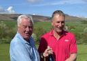 Stephen Webster (right) being presented with a bottle of Champagne, courtesy of Skipton Self Drive, by retiring men’s captain Roger Moore