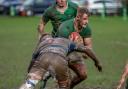 Wharfedale (green) and Tynedale battle it out in the muddy conditions. Photo credit: John Burridge