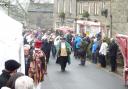 The procession makes its way through Grassington