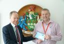 Paul Shevlin receives the election writ from Ian Milner, Royal Mail manager