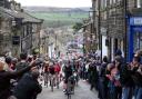 Riders scale the iconic Main Street in Haworth during a previous year's Tour de Yorkshire.
