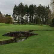 The picturesque approach to the signature 18th hole of the Hunting course
