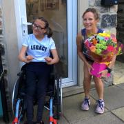 Cross Hills' Tracy Bailey receives some flowers from Charlotte Wormald