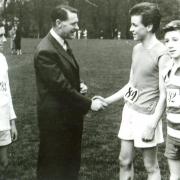 Roger Ingham winning the senior race in 1961 being congratulated by the then headmaster of Ermysted's Jack Eastwood