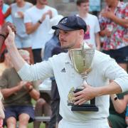 Settle skipper Will Davidson with the Ribblesdale League Cup