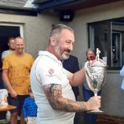 Thornton-in-Craven skipper Ian Holden with the Cowling Cup