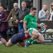 Chester's Ben Ivory hauls down Wharfedale's Oscar Canny and gets yellow carded for his actions. Pic: John Burridge
