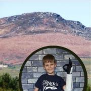 Embsay Crag. Inset, Luke Mortimer last year with his new arm