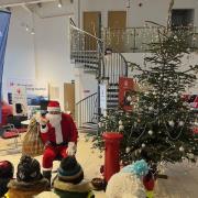 Santa paid a visit to Bristol Street Motors where he met schoolchildren