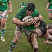 Wharfedale (green) look to burst through the Sheffield defence in tricky conditions. Photo credit: John Burridge