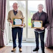 Men of the moment. Chris Smales, right, and Ron Whalley proudly display their life membership certificates. Image: Skipton Golf Club