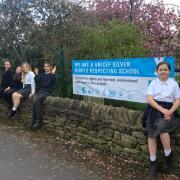 Glusburn schoolchildren with the school's new UNICEF banner