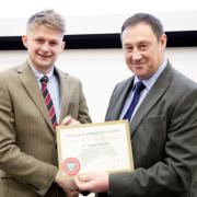 CCM’s Kyle Hawksworth, left, receives his LAA diploma from chairman Alistair Brown.