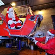 Santa's sleigh is checked to make sure it is ready for the road