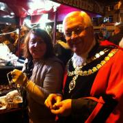 Skipton Mayor Cllr John Dawson enjoys some traditional Christmas goodies at Skipton lights switch on