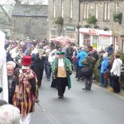 The procession makes its way through Grassington