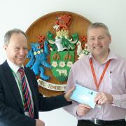 Paul Shevlin receives the election writ from Ian Milner, Royal Mail manager