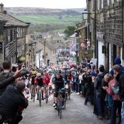Riders scale the iconic Main Street in Haworth during a previous year's Tour de Yorkshire.