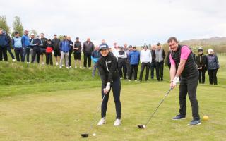 Pictured on the 13th tee at Skipton Golf Club when the new 2024 season officially teed-off are Men's and Ladies' Captains Ollie Burton and Sarah Howes, closely watched by some of the members.