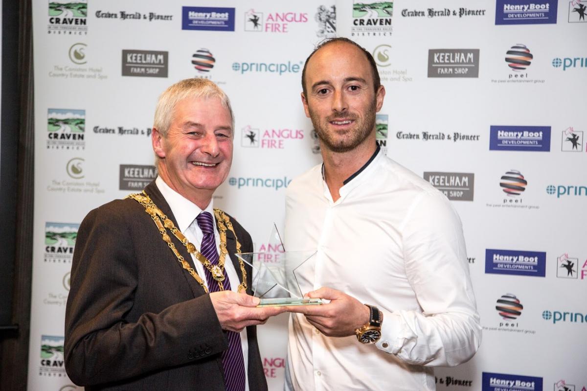 Adam Cox receives the Sport Award from Chris Moorsby