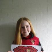 Competition winner, 10-year-old Mia Hewitt, with her shirt design