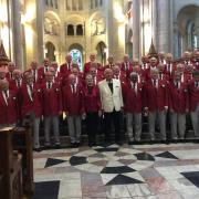 Steeton Male Voice Choir at Belfast Cathedral, with accompanist Pat Jones and deputy conductor Noel Aspinall in the centre.