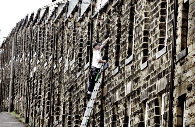"If you could see what I can see, when I’m cleaning windows" –  as George Formby sang. This window cleaner, photographed by Craven Herald cameraman Stephen Garnett, has his work cut out tackling the steep Victorian terraces of Middletown, Skipton