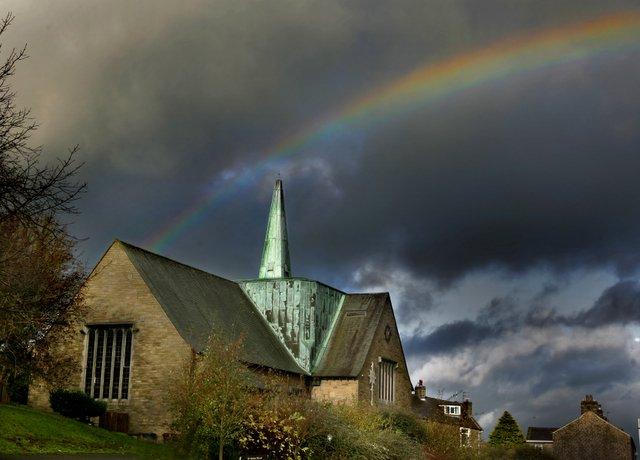 Every cloud has a silver lining, they say. 
After all the recent miserable weather, this was the cheerier scene as a rainbow arrowed across the sky over  Barnoldswick’s Holy Trinity Church.