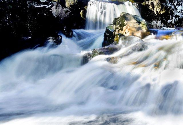 The swirling, fast-flowing waters of Linton Falls, near Grassington