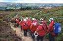 The team carrying the casualty off Ilkley Moor. Picture UWFRA