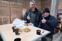 John Midgley, right, in Ukraine, enjoying Lviv apple cake and Yorkshire carrot cake