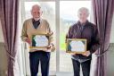 Men of the moment. Chris Smales, right, and Ron Whalley proudly display their life membership certificates. Image: Skipton Golf Club