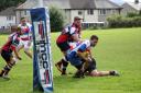 Craig Nicholson goes over for a try for Cowling Harlequins