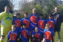 Cowling under-11s show off their new kit, sponsored by Tip Top Tasters