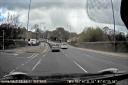 An Audi driver overtakes traffic before going through a red light and turning left