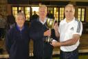 Peter Clark receives the Norman Johnston Trophy from ex President Roy Sanderson, also in the picture runner up David Scott.