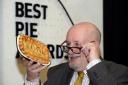 The late James Wilson inspecting a pie in his capacity as head judge of the World Pie Championship, Barnoldswick in 2019