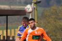 Wissam Badri (orange) struck a hat-trick for AFC Barnoldswick. Picture: Peter Naylor.
