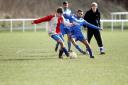 Shazab Hussain battles for the ball for FC Sporting Keighley