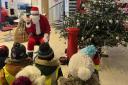 Santa paid a visit to Bristol Street Motors where he met schoolchildren