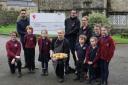 The cheque is handed over to Burnsall school