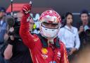 Ferrari driver Charles Leclerc celebrates taking pole position (Luca Bruno/AP).