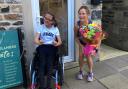 Cross Hills' Tracy Bailey receives some flowers from Charlotte Wormald