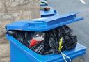 Blue, recyclng bin with wrong rubbish