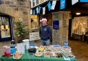 Andrew Mear mans the charity cake bake at High Corn Mill